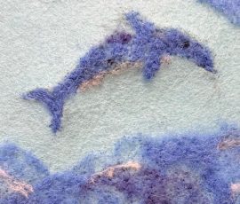 Ant veltinio pavaizduotas delfinas